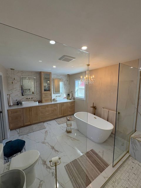 Luxury bathroom with custom glass shower enclosure